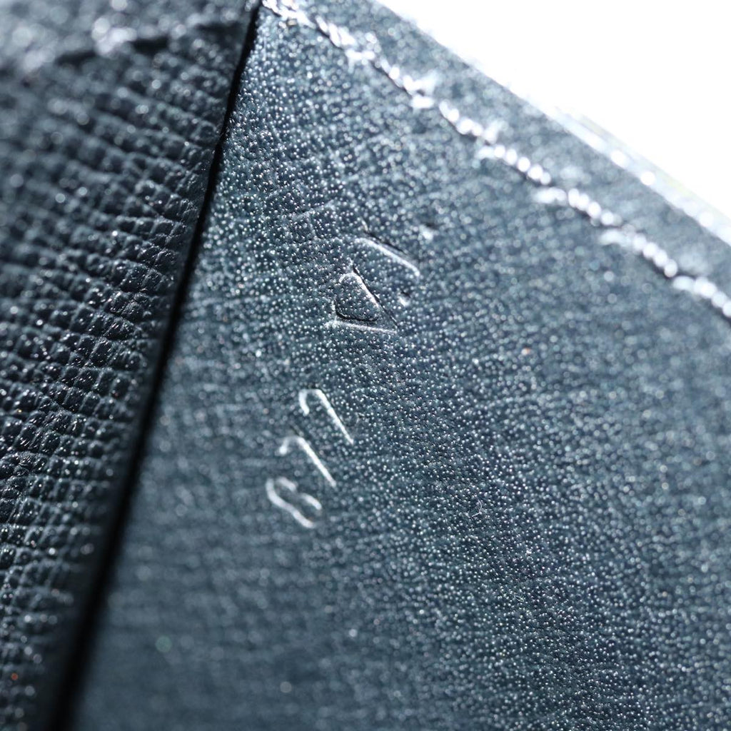 Louis Vuitton Montaigne  Leather Clutch Bag