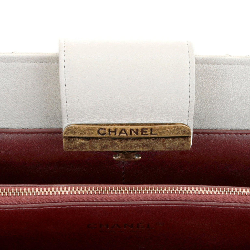 Chanel Ivory Lambskin Clutch with CC Enamel & Bronze Hardware