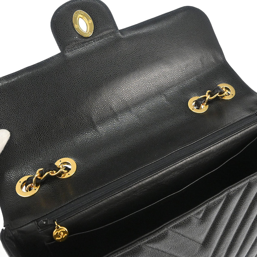 Chanel 1991-1994 Black Caviar Skin Chevron Maxi Classic Flap Shoulder Bag