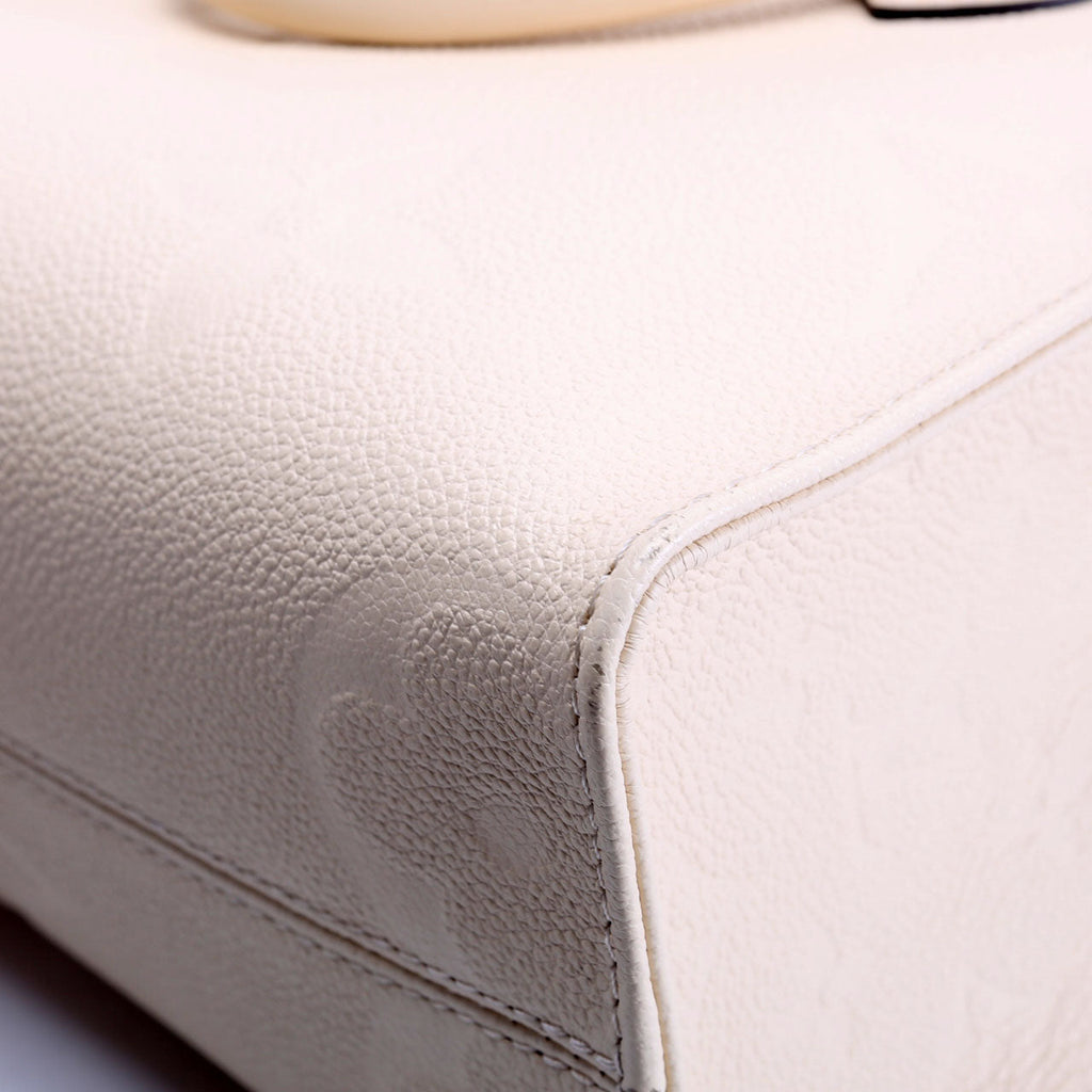 Louis Vuitton ONTHEGO PM Empreinte Cream