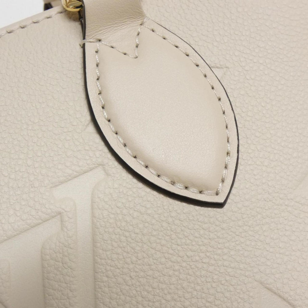 Louis Vuitton Monogram Empreinte Gold Leather Handbag