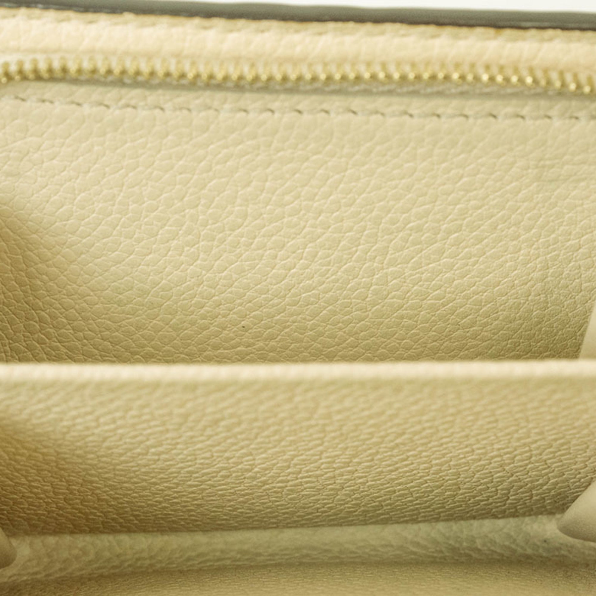 Louis Vuitton Cream Monogram Empreinte Leather Wallet