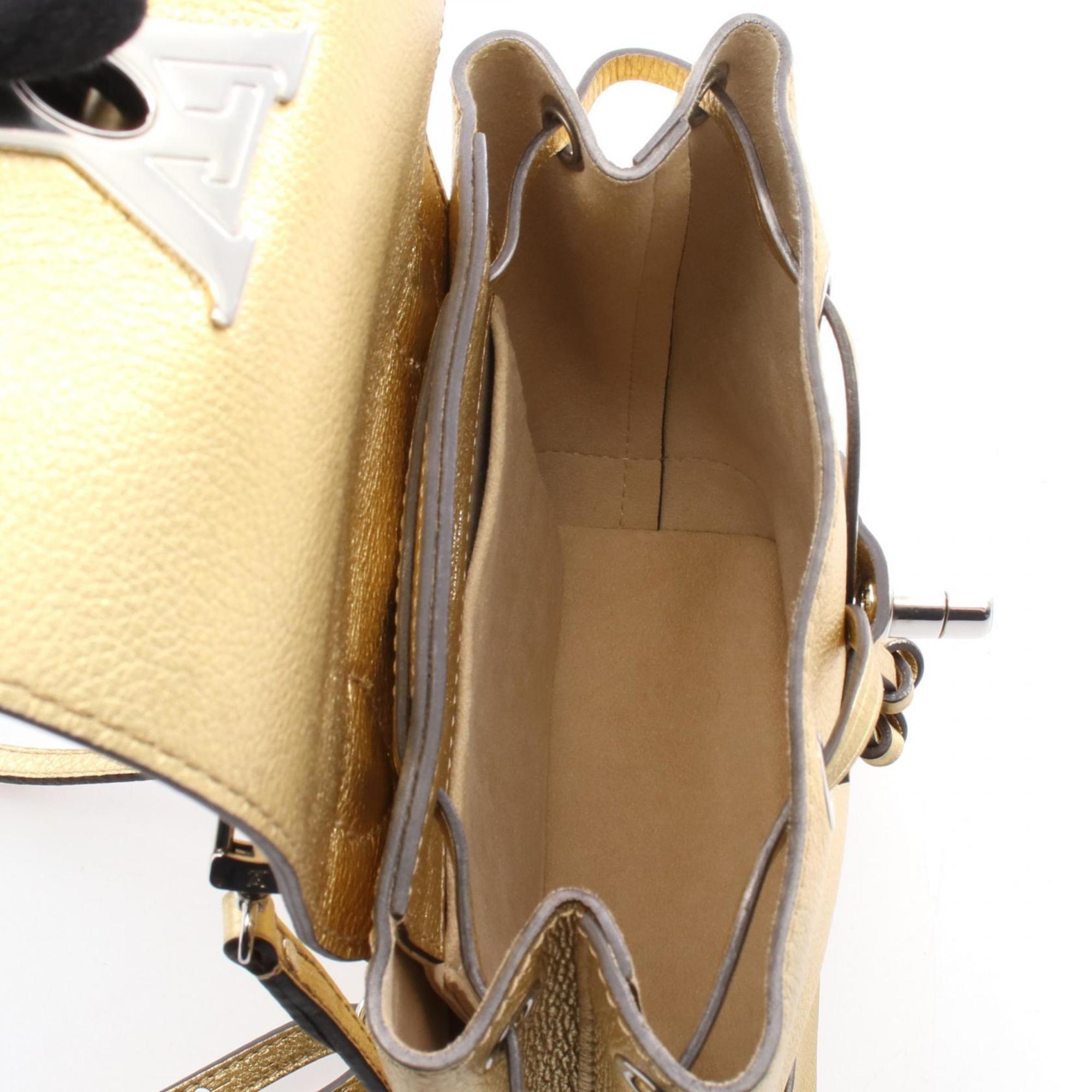 Louis Vuitton Gold Leather Backpack