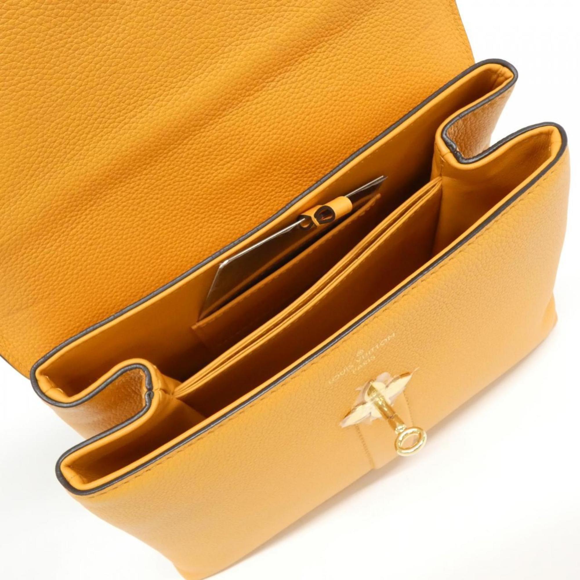 Louis Vuitton Gold Leather Handbag