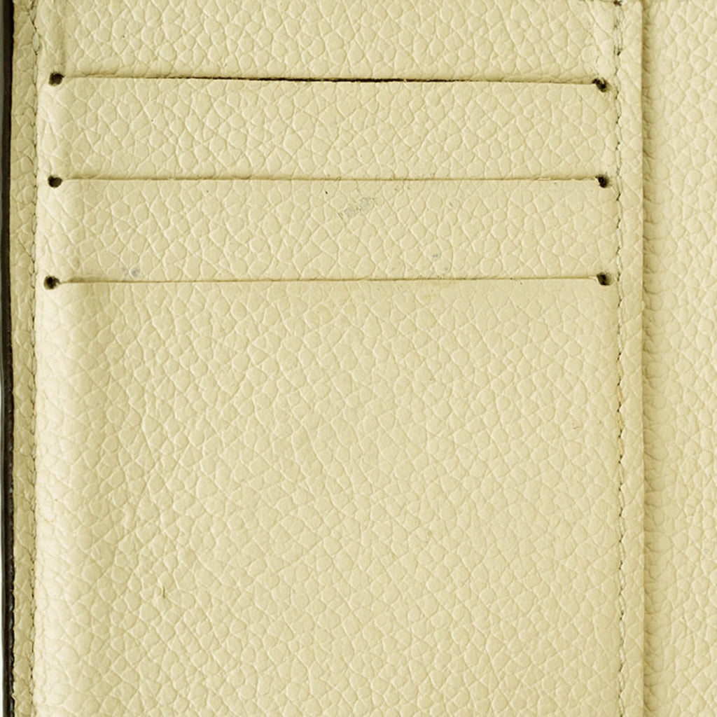 Louis Vuitton Cream Monogram Empreinte Leather Wallet