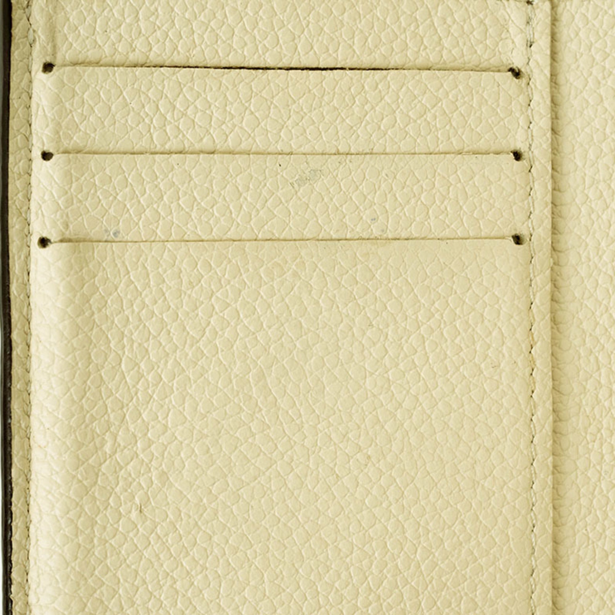 Louis Vuitton Cream Monogram Empreinte Leather Wallet