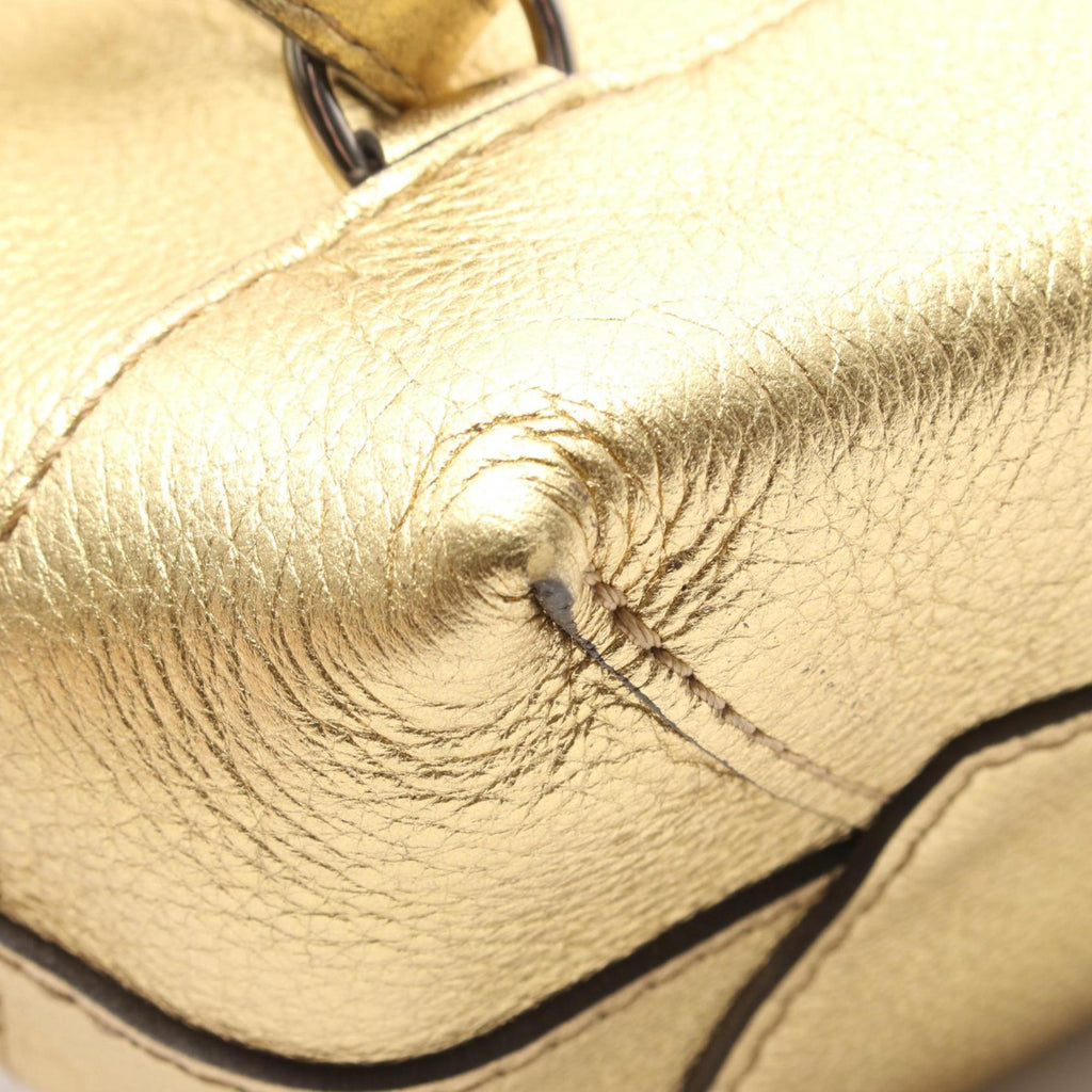 Louis Vuitton Gold Leather Backpack