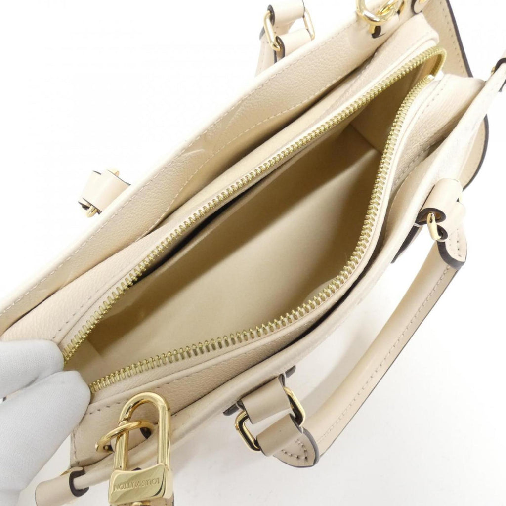 Louis Vuitton Monogram Empreinte Gold Leather Handbag