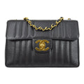 Chanel * 1994-1996 Black Caviar Jumbo Vertical Stitch Classic Flap
