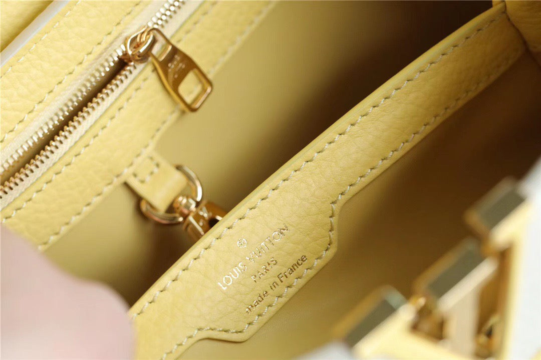 Louis Vuitton Capucines MM Taurillon Creme Beige/ Plume Yellow Berlingot For Women, WomenÃƒÂ¢Ã¢â€šÂ¬Ã¢â€žÂ¢s Bags, Shoulder And Crossbody Bags 12.4in/31.5cm Louis Vuitton M59883