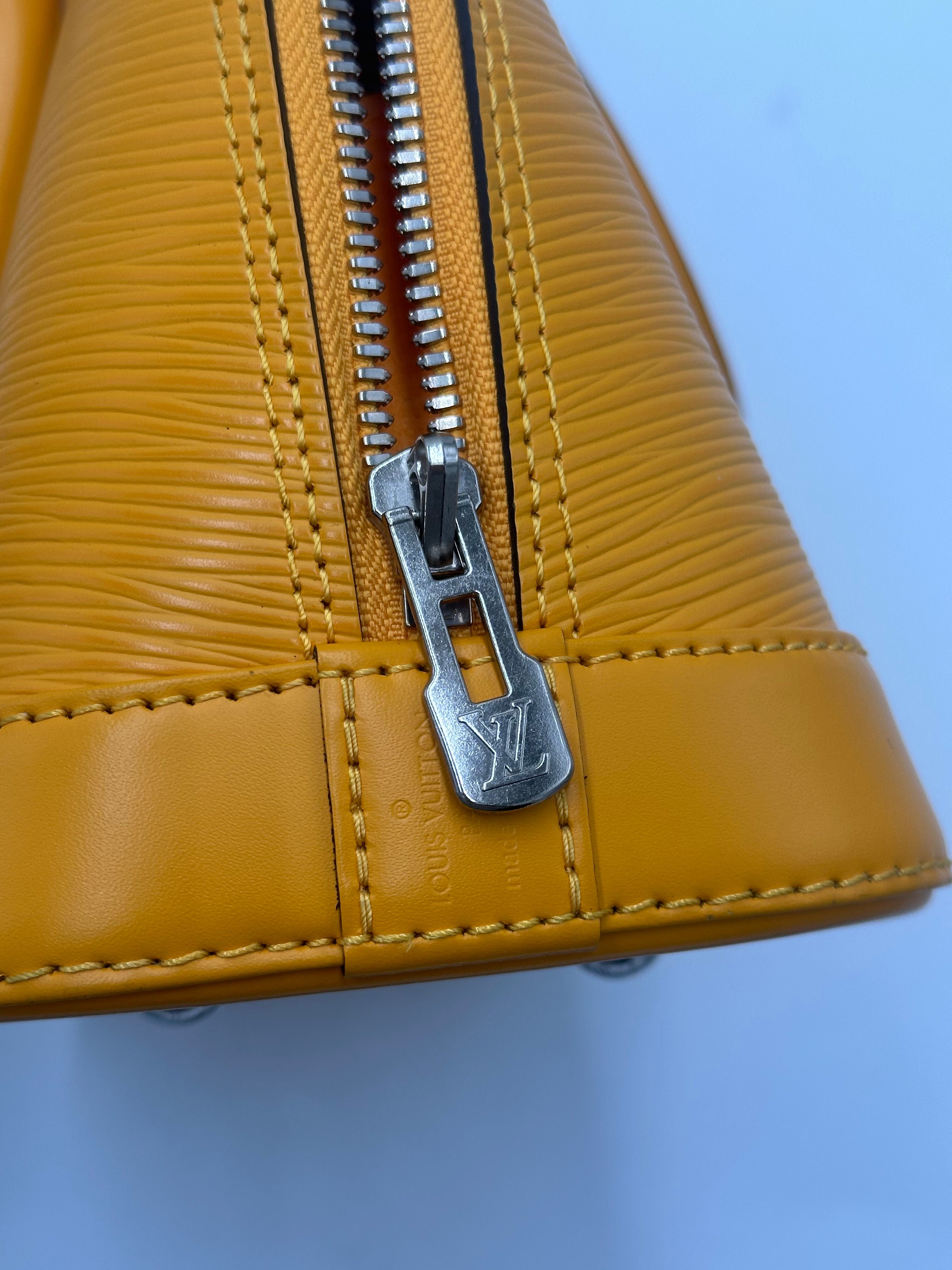 Louis Vuitton Alma Handbag Epi Leather Yellow Leather Handbag