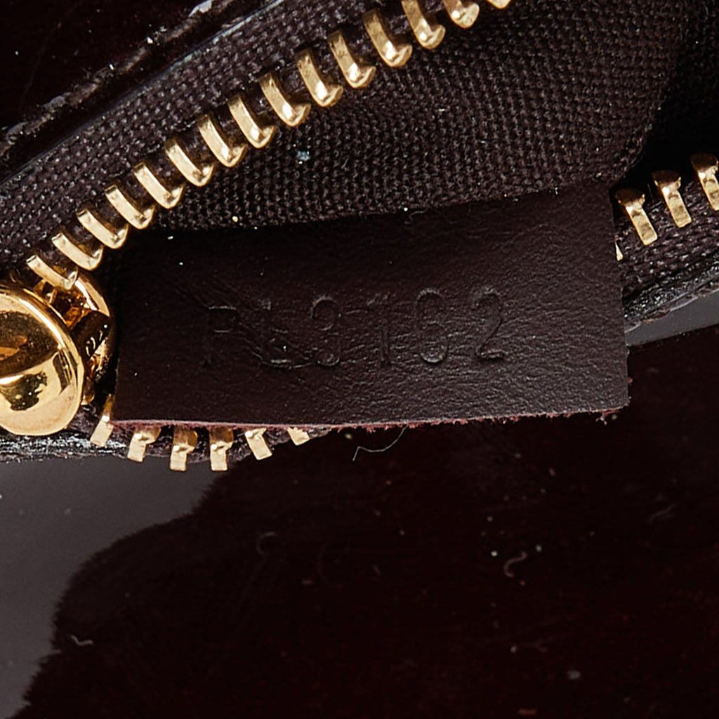 Louis Vuitton Amarante  Leather Sobe Clutch