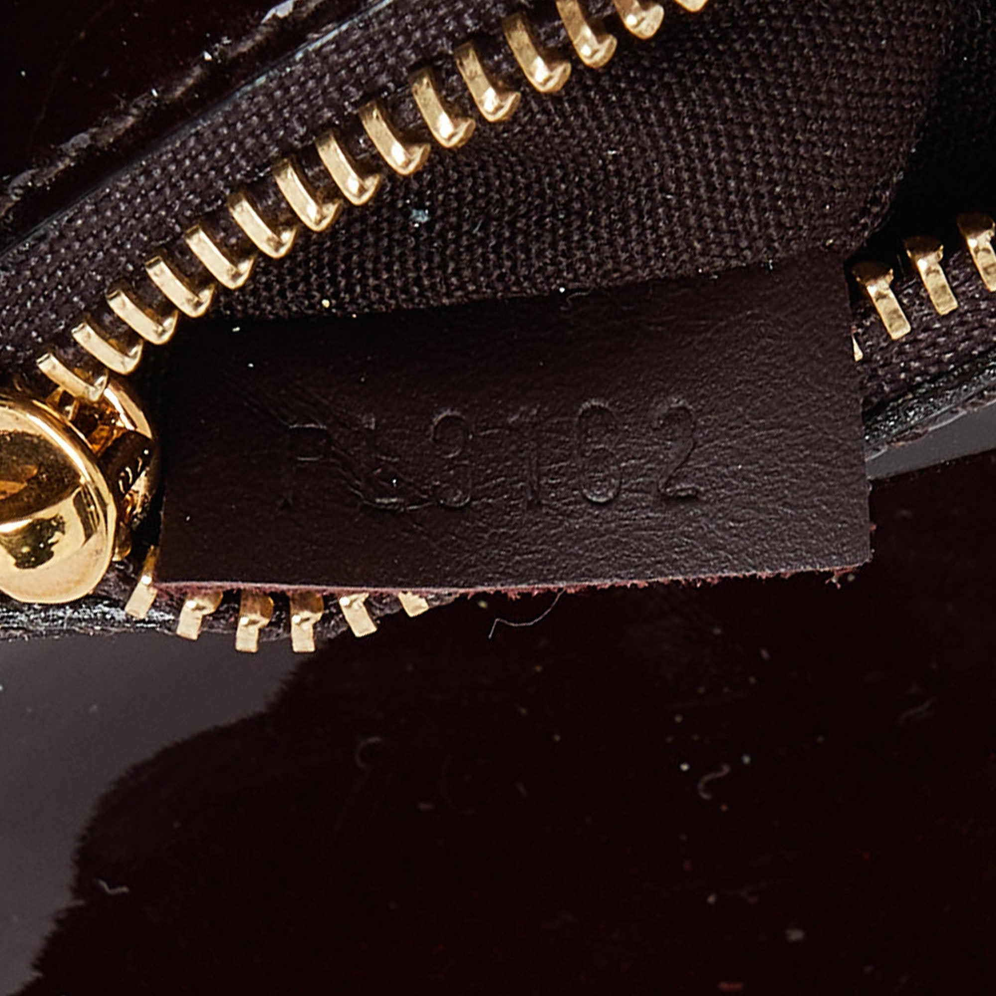 Louis Vuitton Amarante  Leather Sobe Clutch
