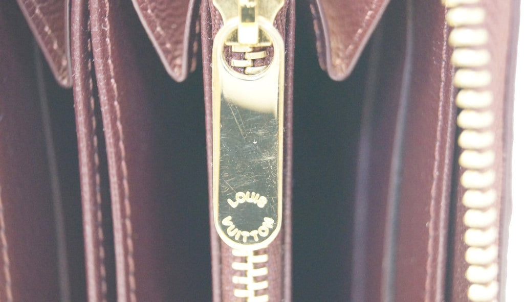 LOUIS VUITTON Burgundy Ostrich Leather Zippy Wallet