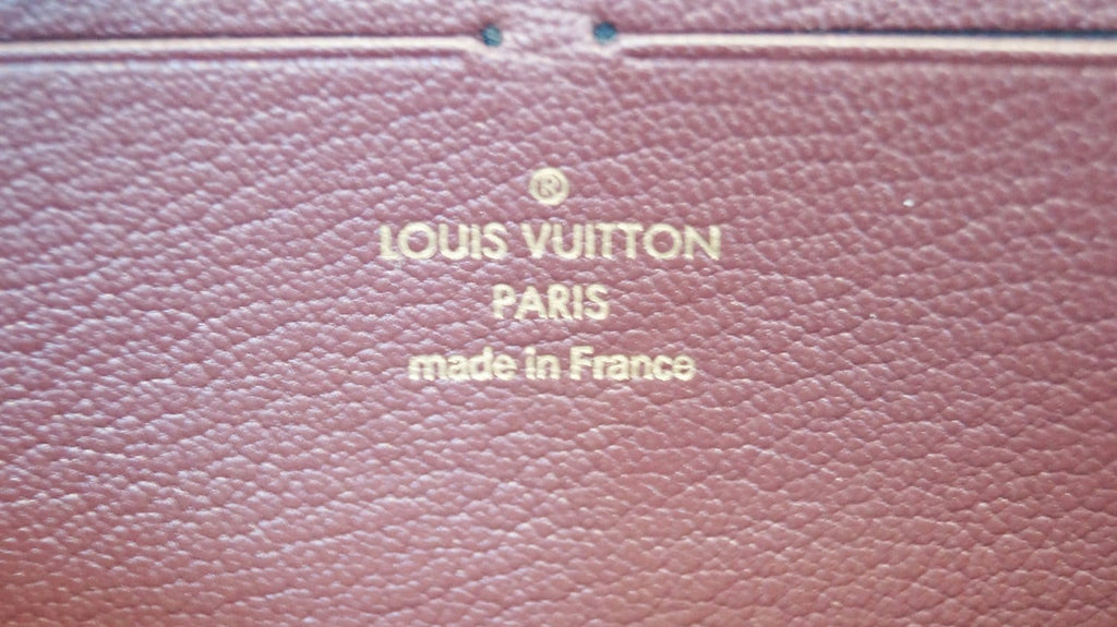 LOUIS VUITTON Burgundy Ostrich Leather Zippy Wallet