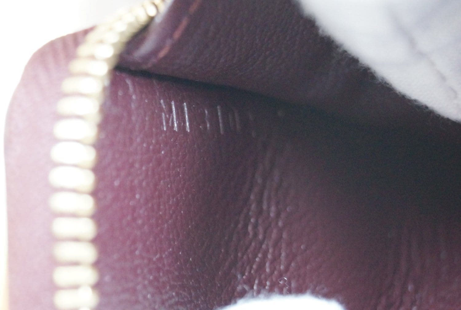 LOUIS VUITTON Burgundy Ostrich Leather Zippy Wallet
