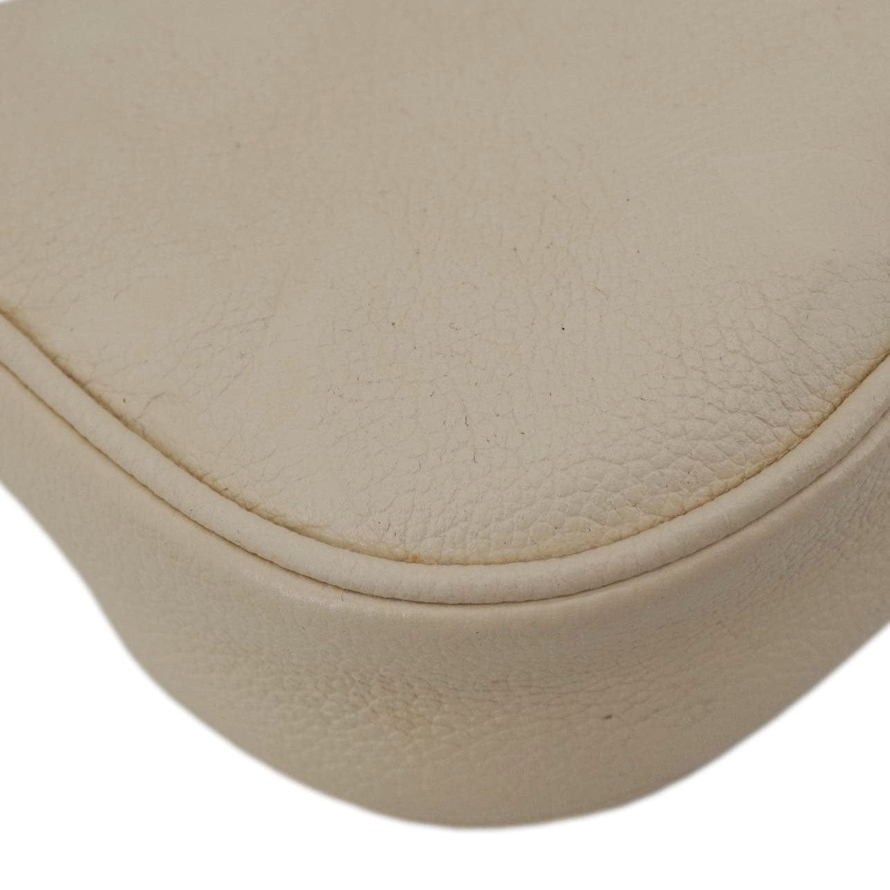 LOUIS VUITTON Moon Mini Monogram Empreinte Leather Hobo Bag Creme