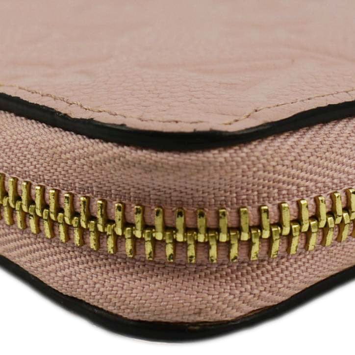 LOUIS VUITTON Clemence Empreinte Leather Wallet Dusty Pink