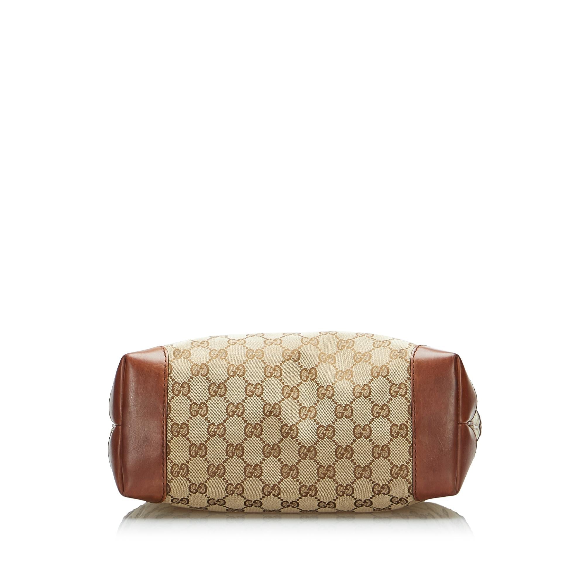 Gucci GG Canvas Stirrup Handbag (SHG-4H8XJO)