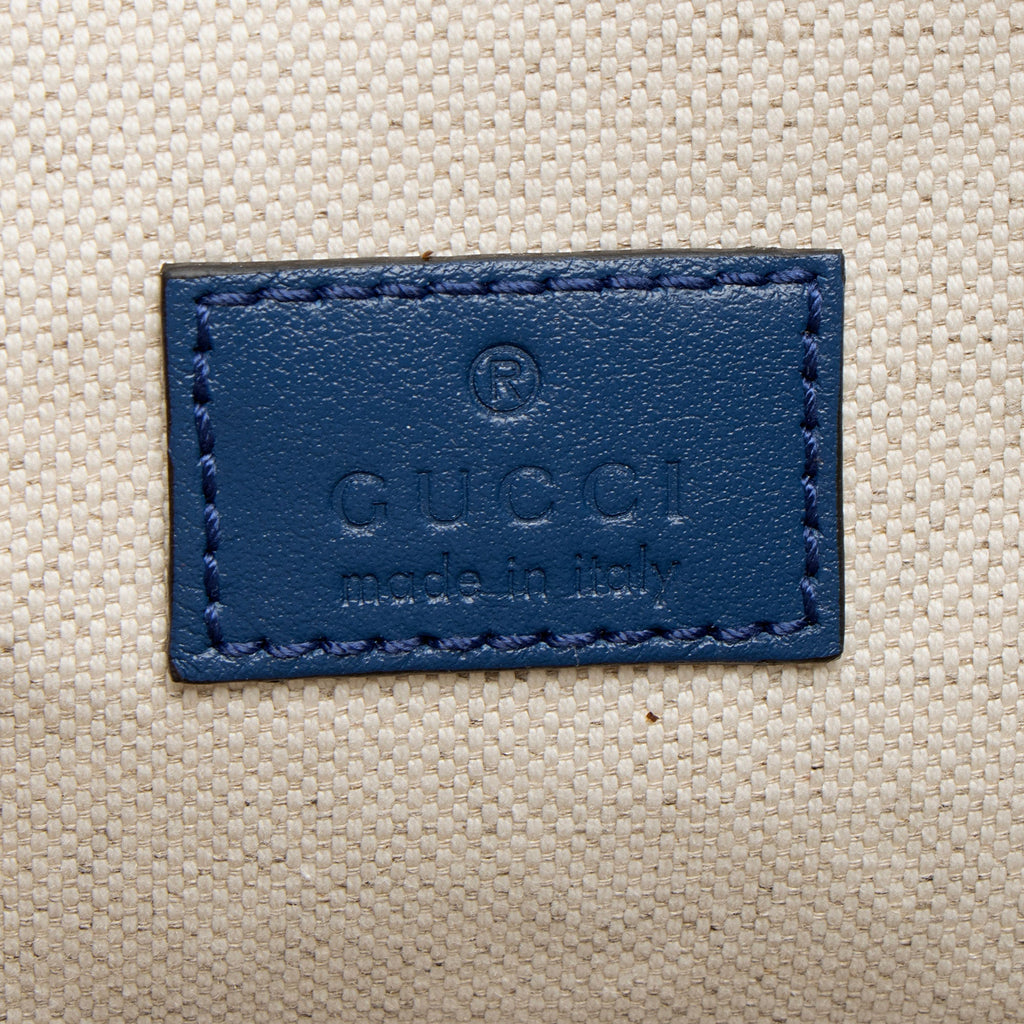 Gucci GG Perforated Embossed Leather Pocket Belt Bag