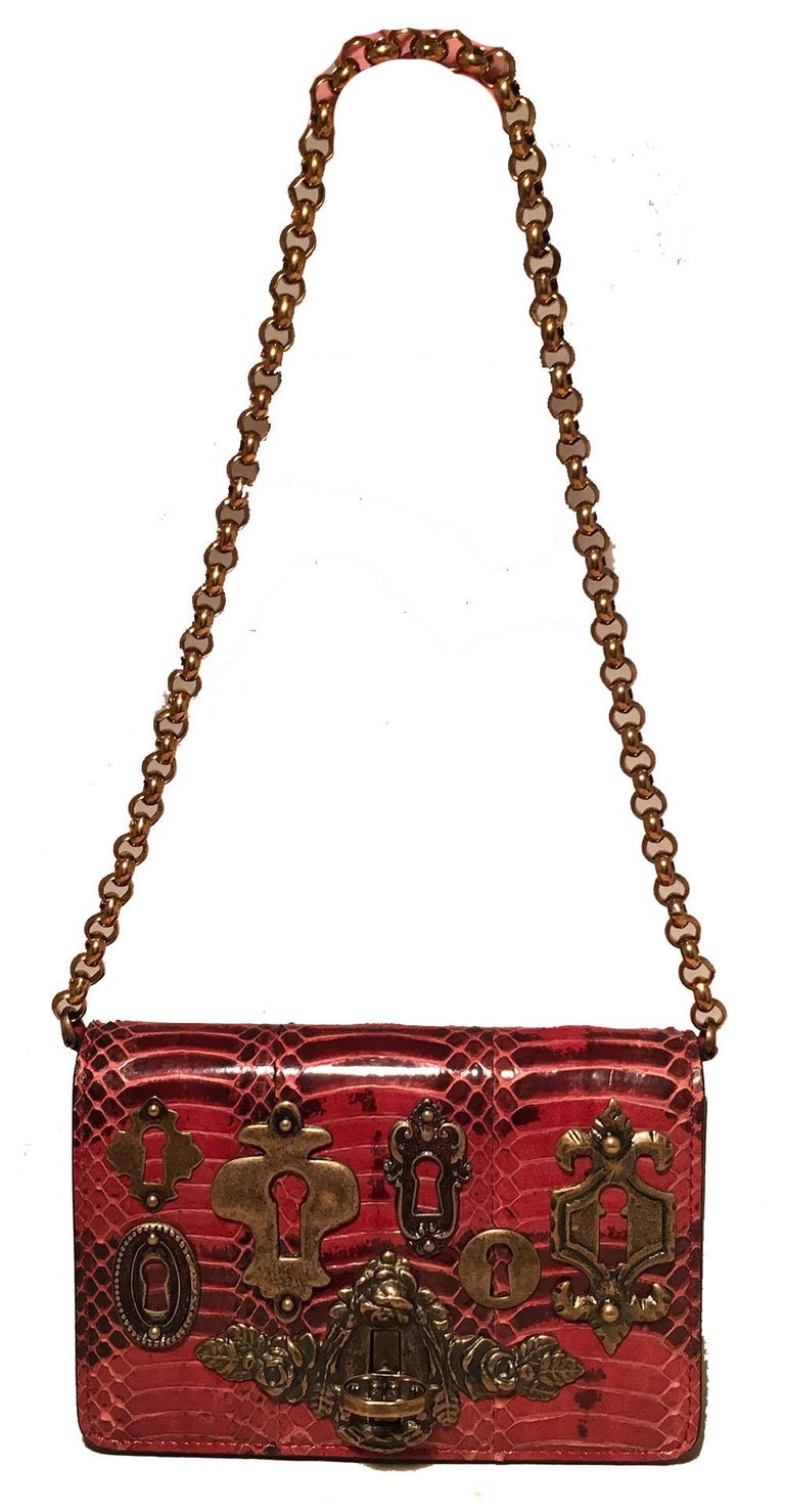 Dolce and GaBurberryana Maroon Snakeskin Keyhole Clutch Bag