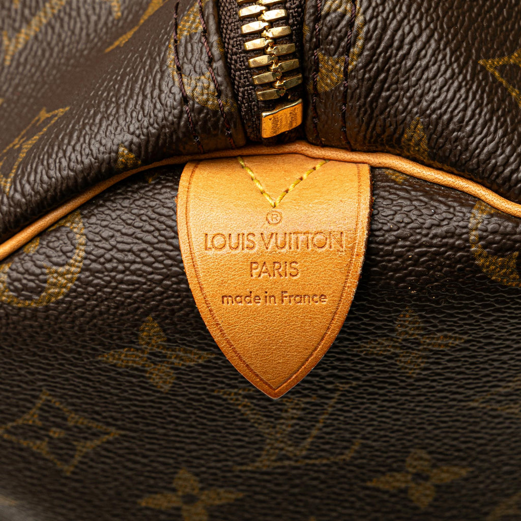 Louis Vuitton Monogram Keepall 50 (SHG-OMzAhA)