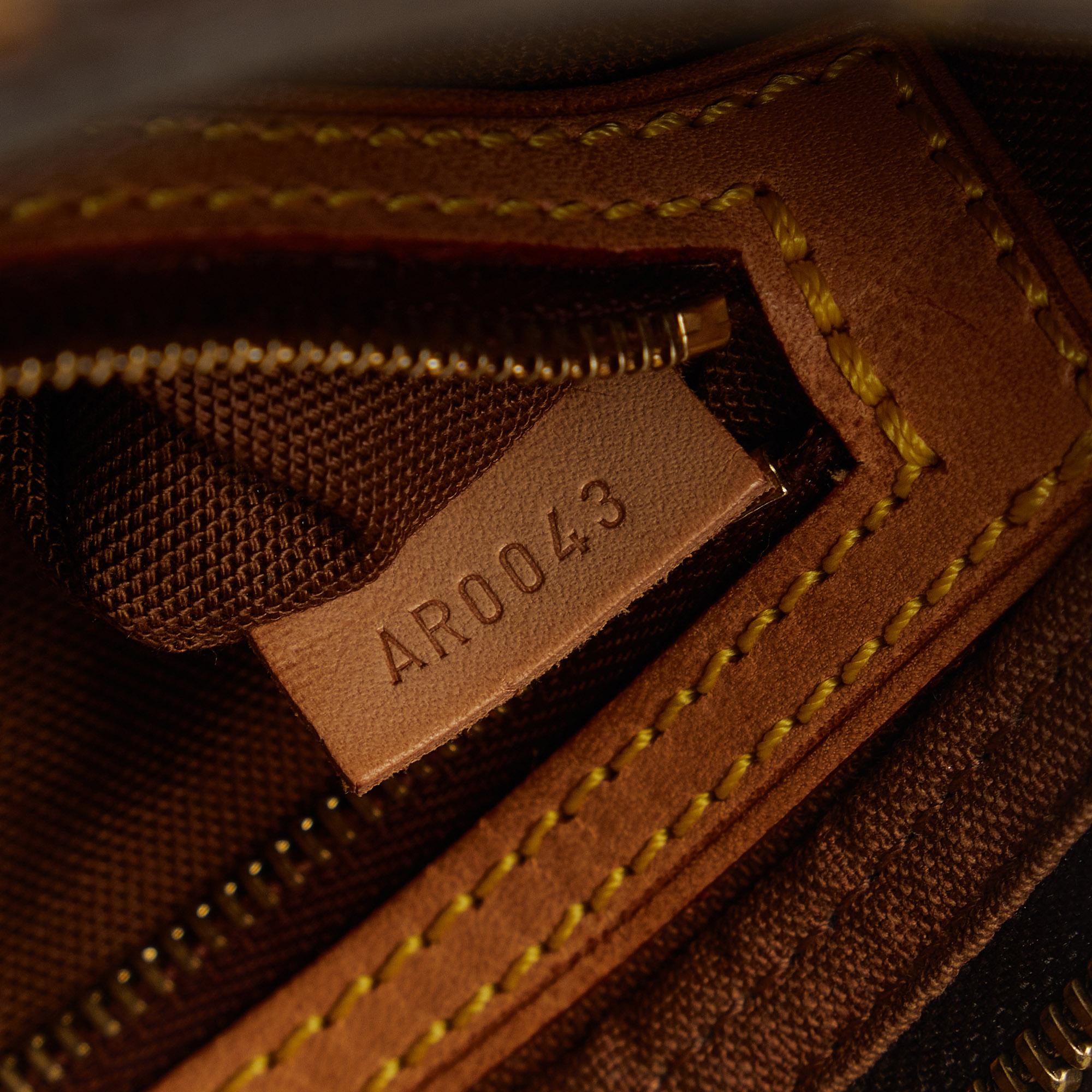 Louis Vuitton Monogram Trotteur (SHG-fngn6l)
