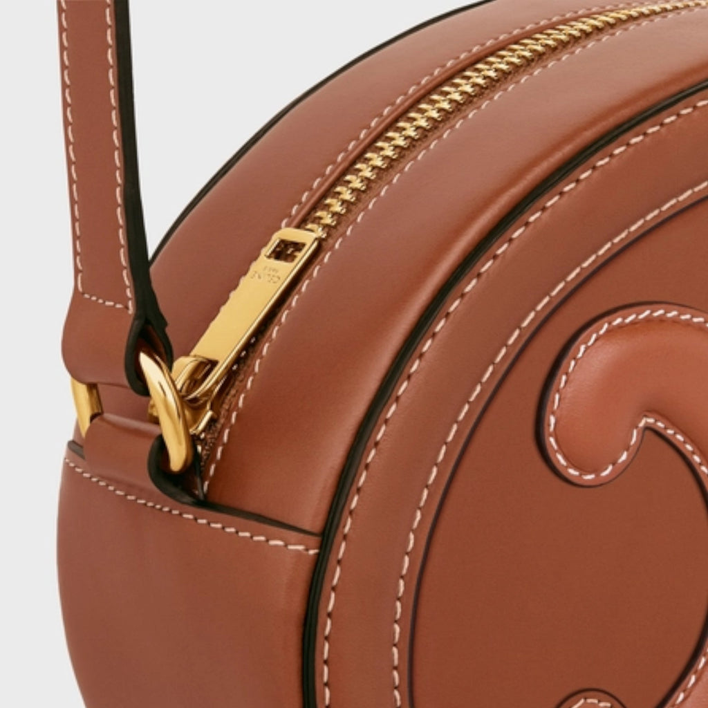 OVAL SHOULDER BAG IN TRIOMPHE