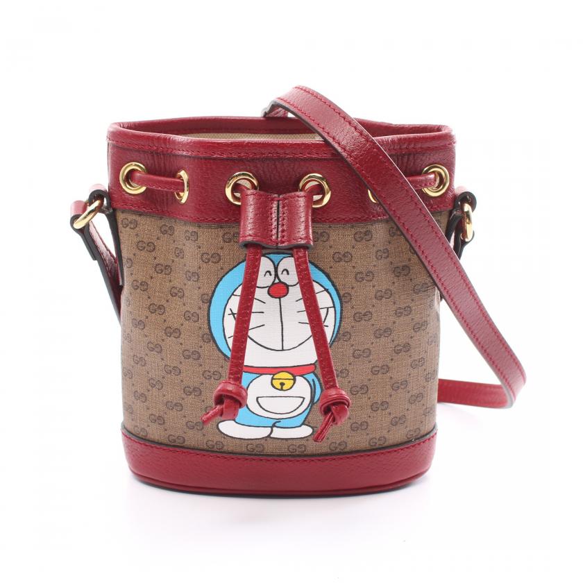 Gucci ÃƒÆ’Ã¢â‚¬â€ Doraemon Mini Bucket Bag in Multicolor PVC Leather - Micro GG Supreme Light Brown Shoulder Bag