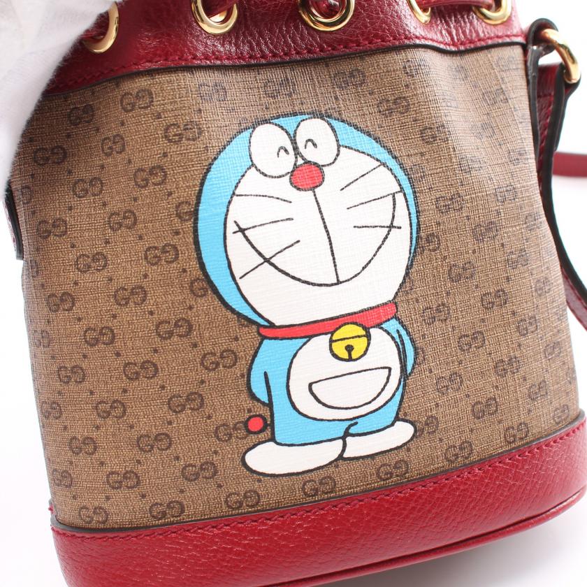 Gucci ÃƒÆ’Ã¢â‚¬â€ Doraemon Mini Bucket Bag in Multicolor PVC Leather - Micro GG Supreme Light Brown Shoulder Bag