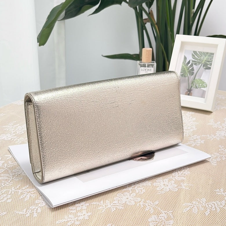 Pre-loved YSL SiLouis Vuittoner Metallic Leather Clutch Bag
