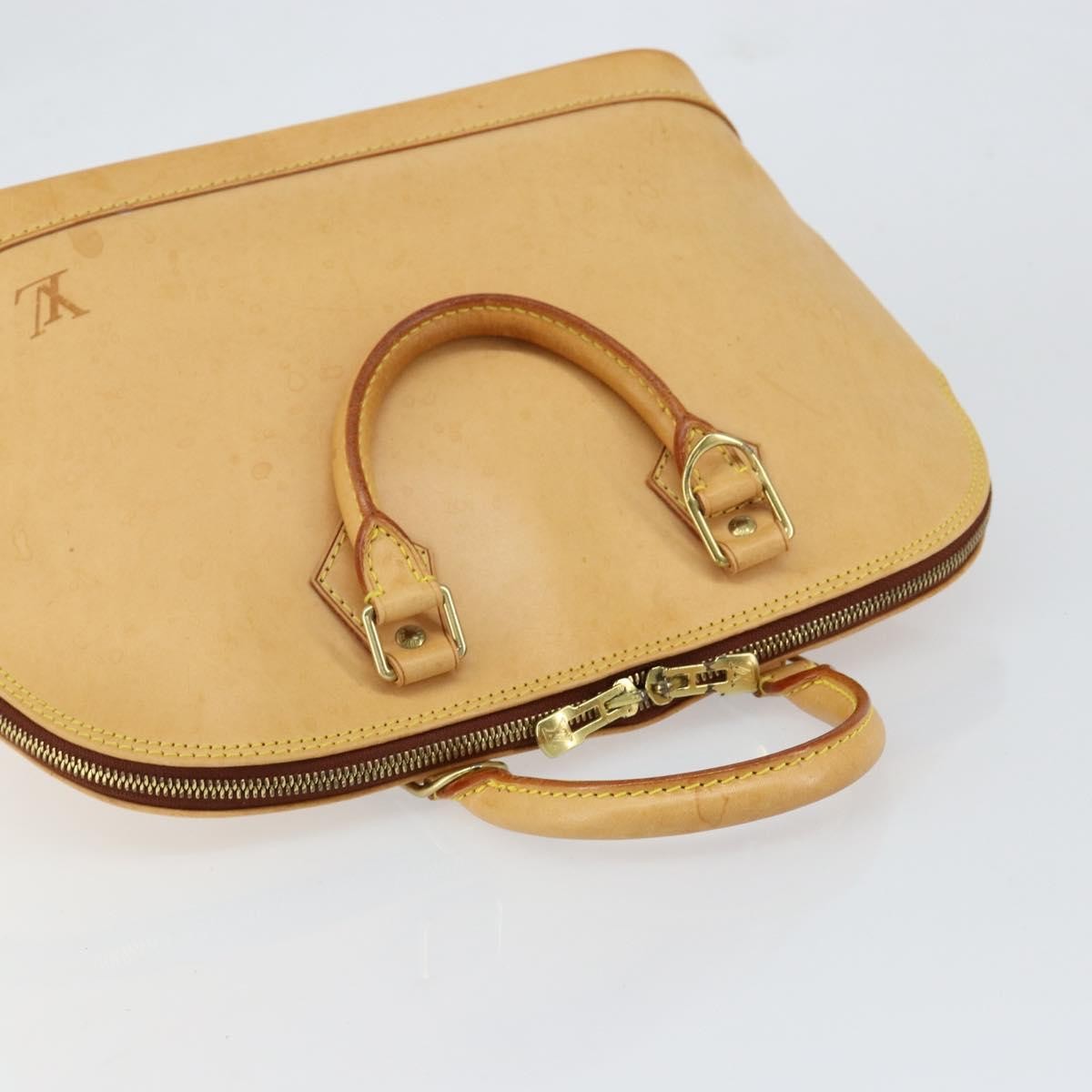 Louis Vuitton Alma Handbag Nomade Leather Beige Leather Handbag