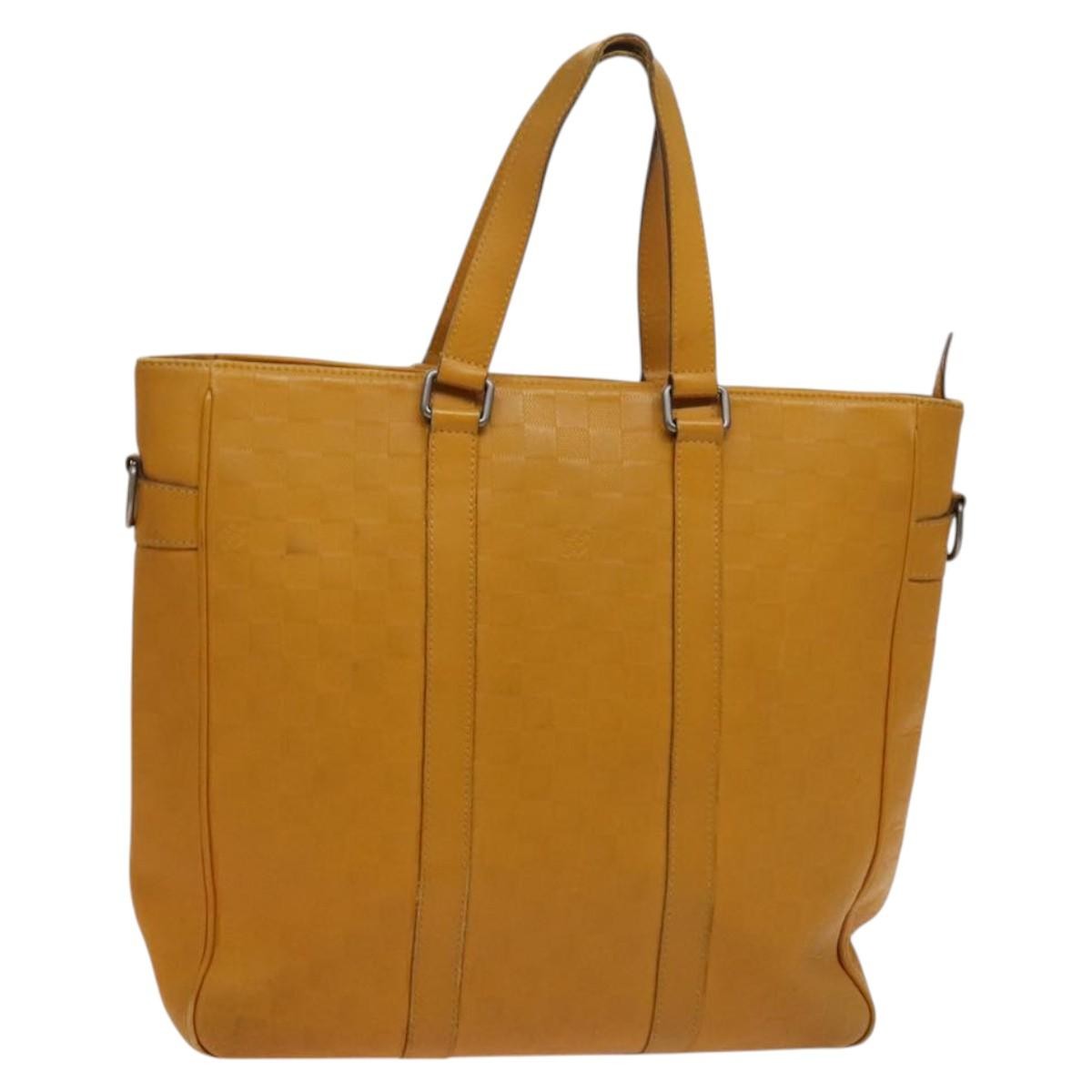 Louis Vuitton Tadao Handbag Damier Infini Leather Yellow Leather Handbag