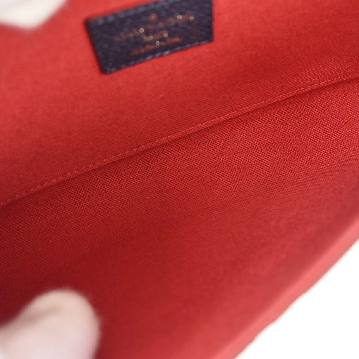 Louis Vuitton Felicie Pochette Monogram Empreinte Leather Navy Leather Clutche & Pouche Bag