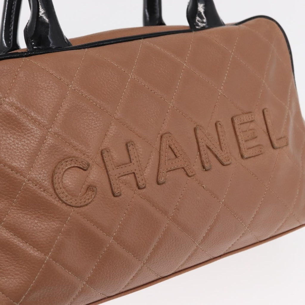 Chanel Embossed Logo Bowler Bag Quilted Caviar Beige Leather Handbag