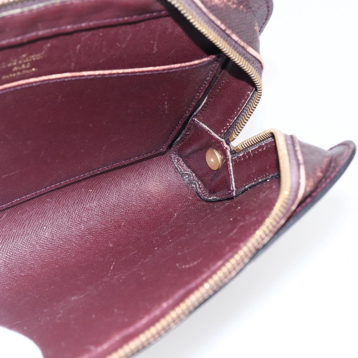 Louis Vuitton Pochette Baikal Clutch Taiga Leather Burgundy Leather Clutche & Pouche Bag