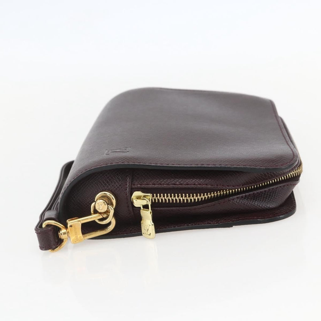 Louis Vuitton Pochette Baikal Clutch Taiga Leather Brown Leather Clutche & Pouche Bag