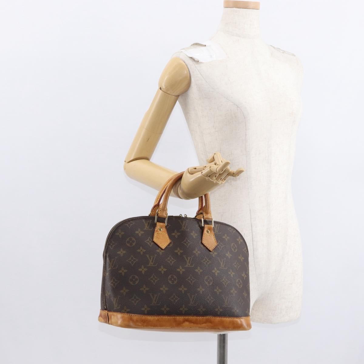 Louis Vuitton Alma Handbag Monogram Canvas Brown Canvas Handbag