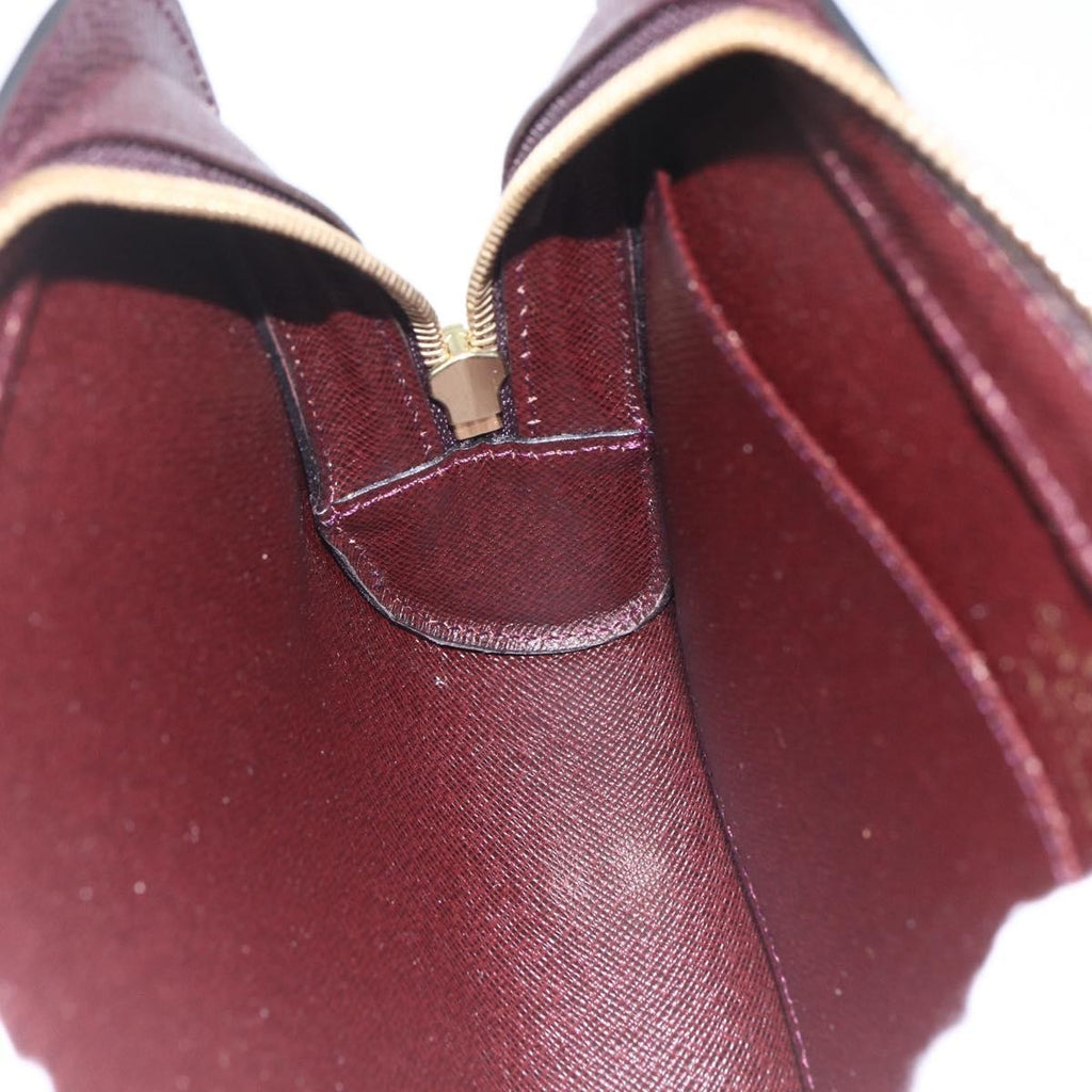 Louis Vuitton Pochette Baikal Clutch Taiga Leather Brown Leather Clutche & Pouche Bag