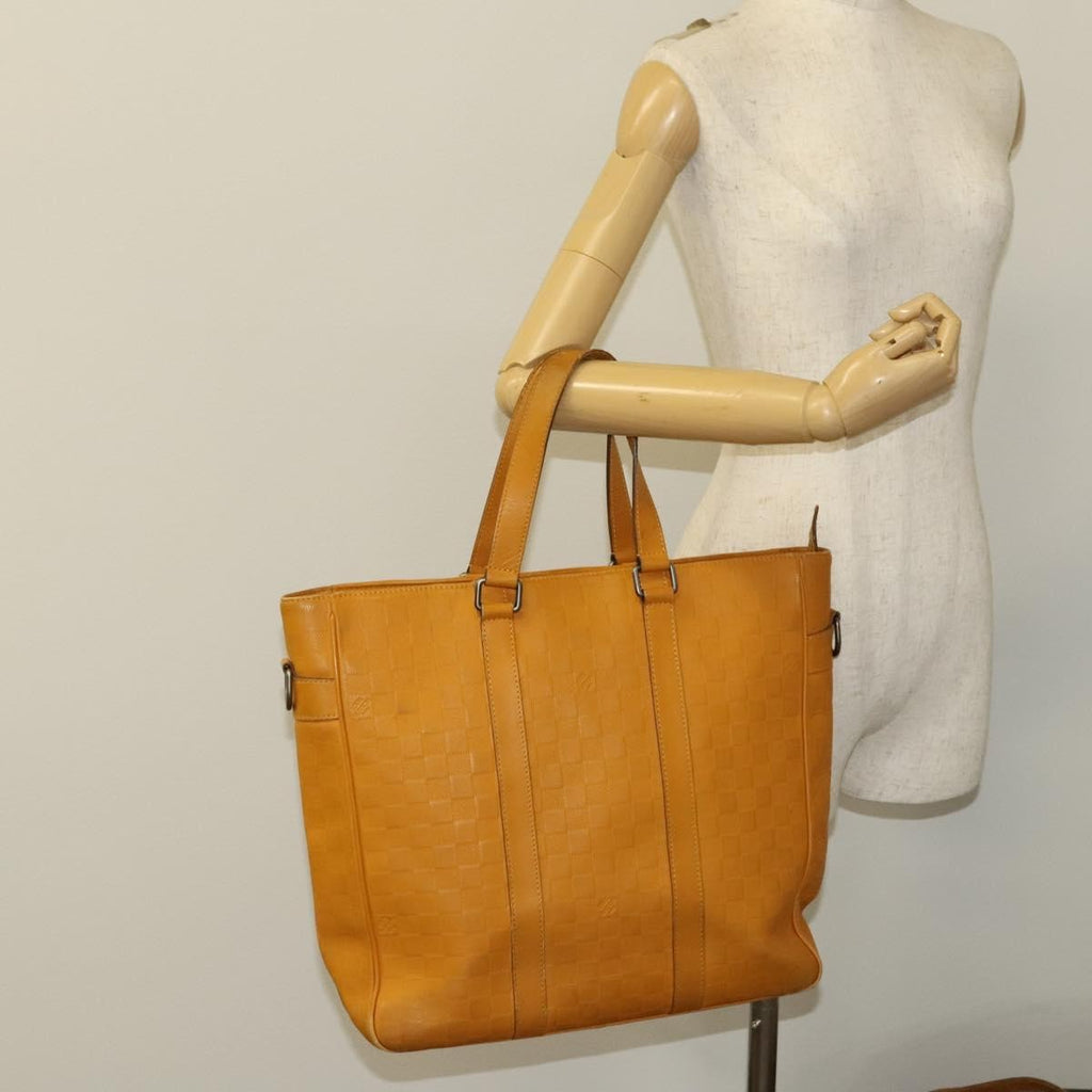 Louis Vuitton Tadao Handbag Damier Infini Leather Yellow Leather Handbag