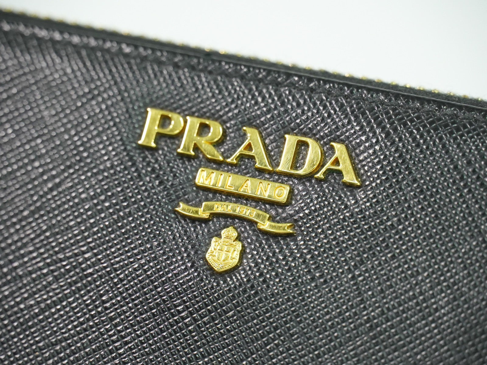 Prada Zip Around Tab Wallet Saffiano Leather Black Leather Wallets Accessory