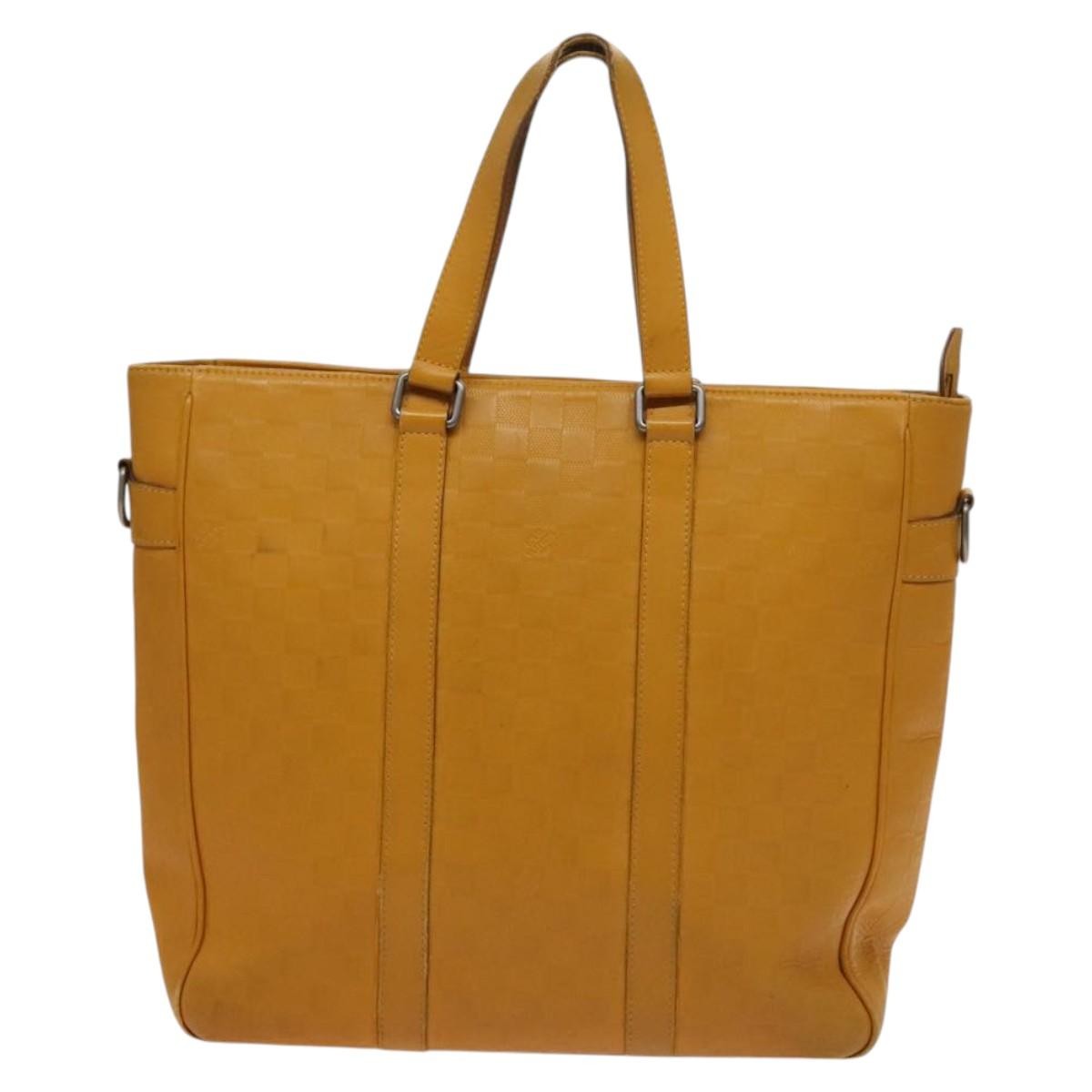 Louis Vuitton Tadao Handbag Damier Infini Leather Yellow Leather Handbag