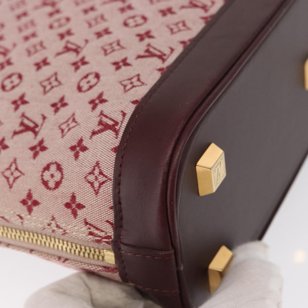 Louis Vuitton Alma Handbag Mini Lin Monogram Red Canvas Handbag