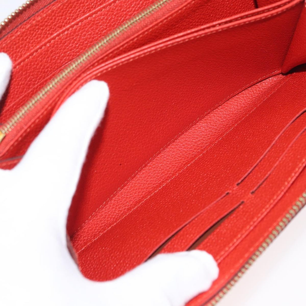 Louis Vuitton Portefeuille Zippy Monogramme Empreinte Monogramme Empreinte Orange Leather Wallets Accessory