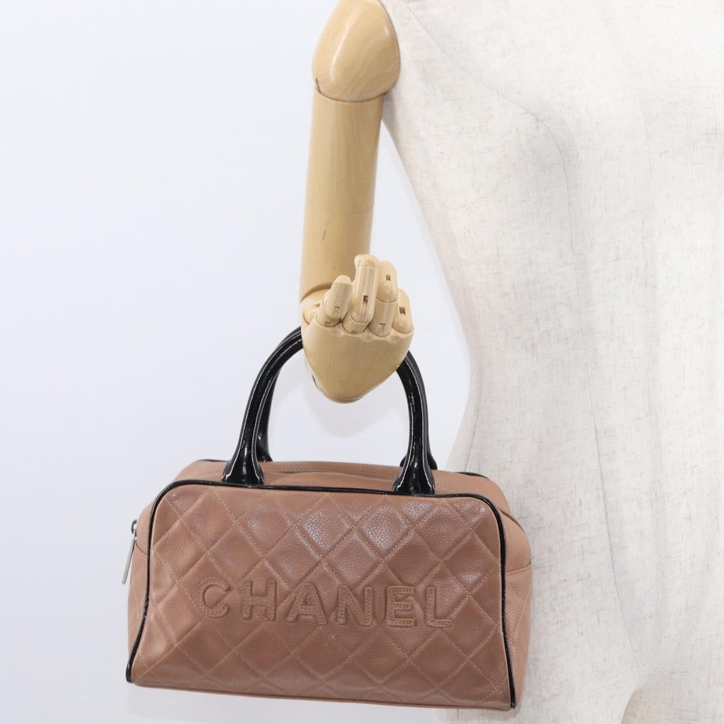 Chanel Embossed Logo Bowler Bag Quilted Caviar Beige Leather Handbag