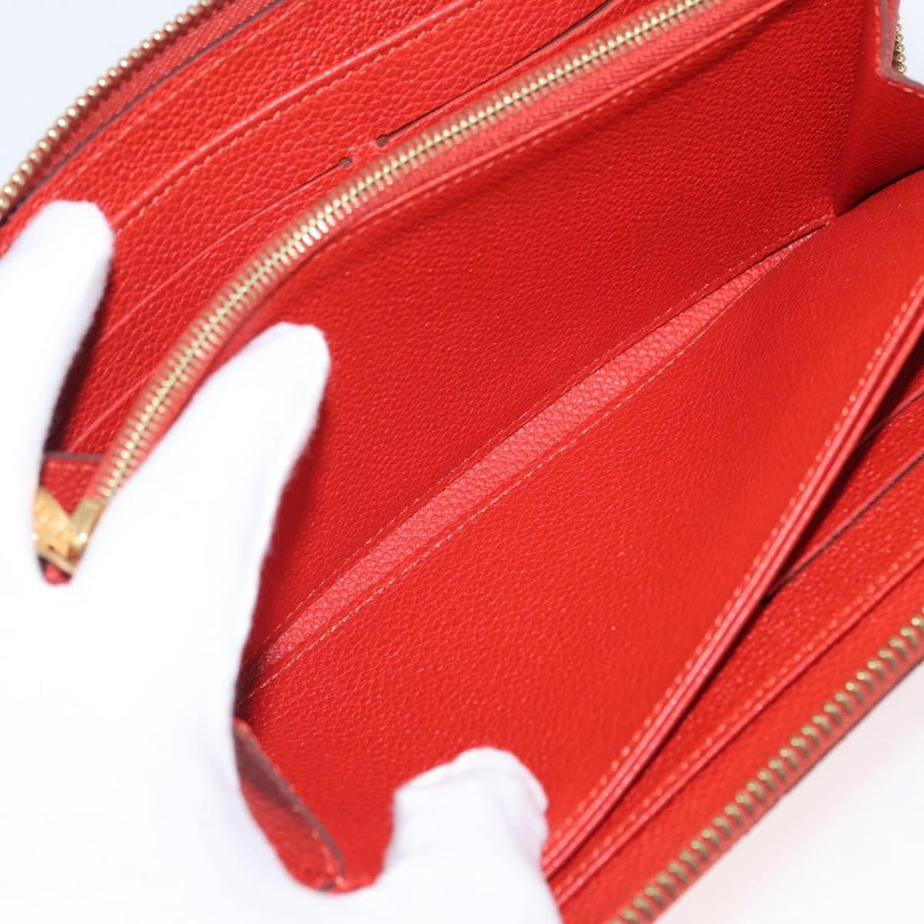 Louis Vuitton Portefeuille Zippy Monogramme Empreinte Monogramme Empreinte Orange Leather Wallets Accessory