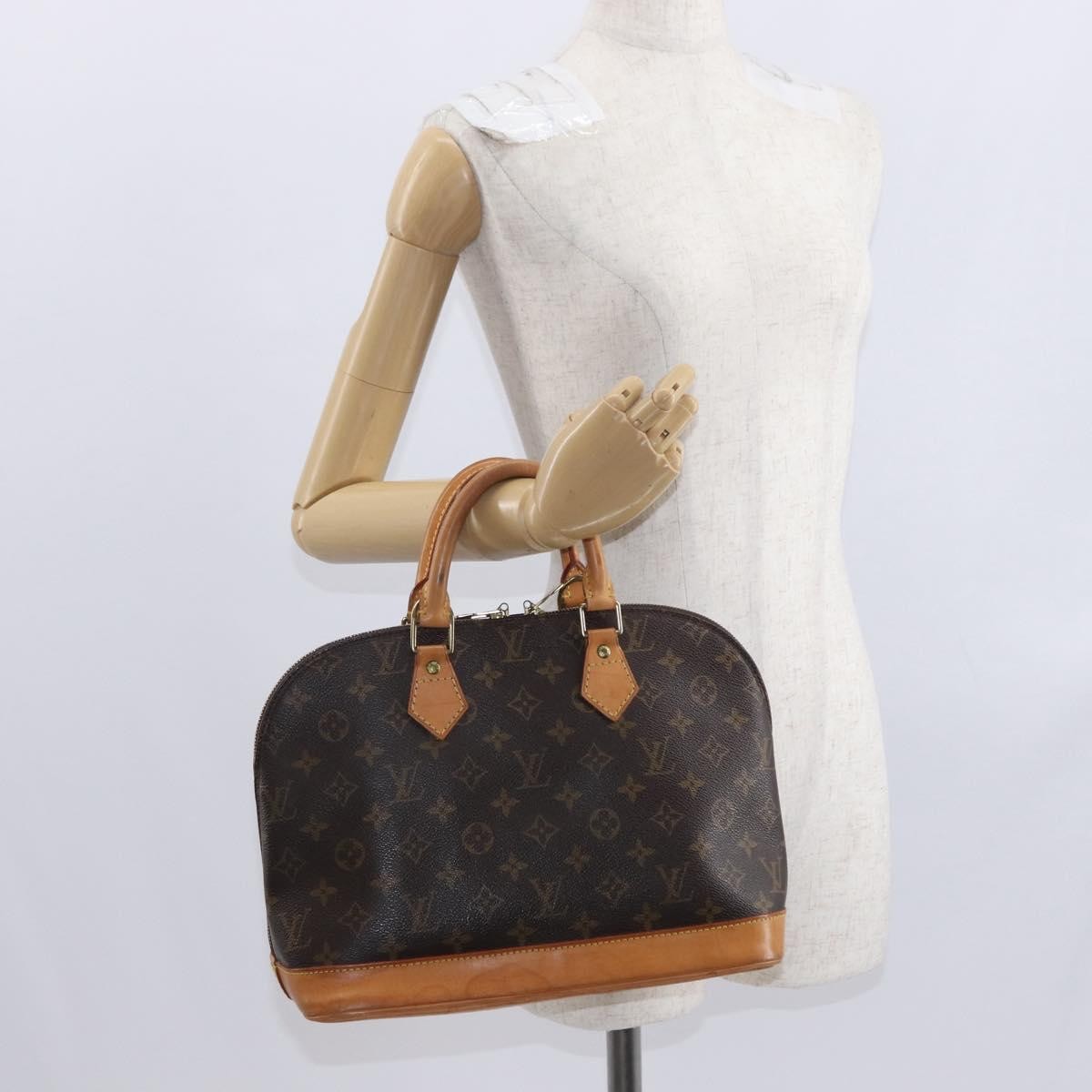Louis Vuitton Alma Handbag Monogram Canvas Brown Canvas Handbag