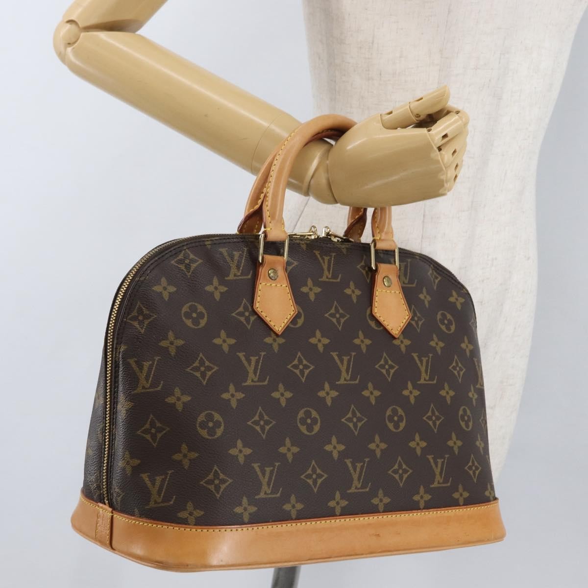 Louis Vuitton Alma Handbag Monogram Canvas Brown Canvas Handbag