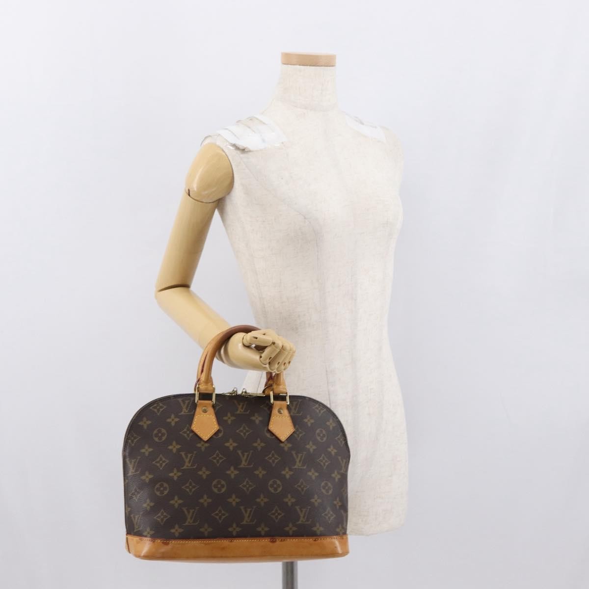 Louis Vuitton Alma Handbag Monogram Canvas Brown Canvas Handbag