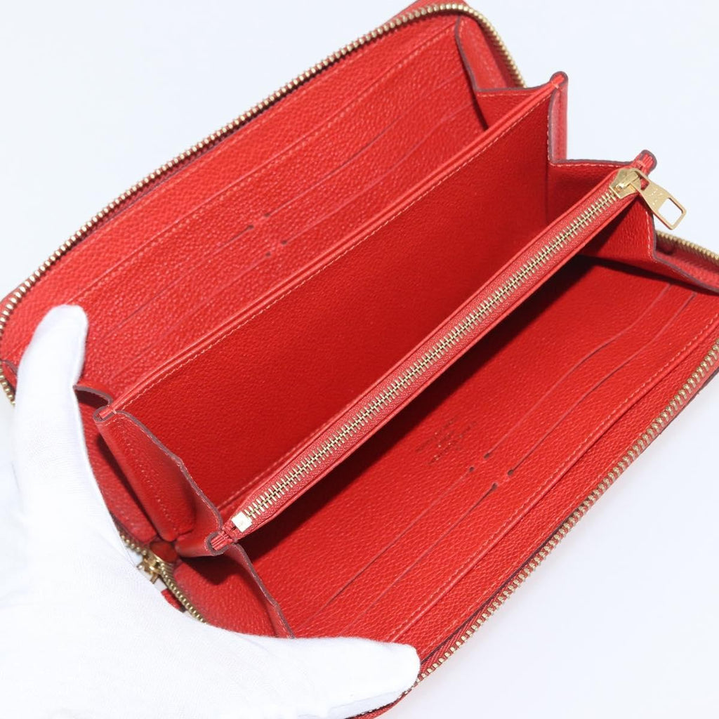 Louis Vuitton Portefeuille Zippy Monogramme Empreinte Monogramme Empreinte Orange Leather Wallets Accessory